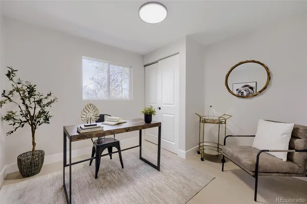 a kitchen with stainless steel appliances a stove a sink a oven a dining table and chairs