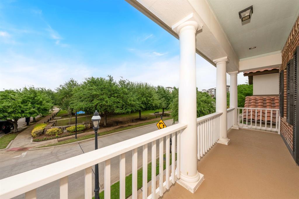 531 Sandy Lane Flower Mound, TX 75022 - Photo 30 of 32 Covered balcony off primary bedroom with classic white columns and balusters