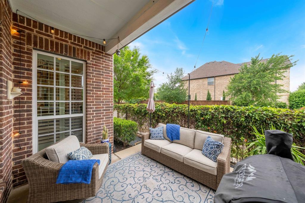 531 Sandy Lane Flower Mound, TX 75022 - Photo 5 of 32 Enjoy mornings with coffee or evening cocktails on the side covered patio.