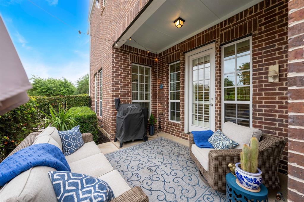 531 Sandy Lane Flower Mound, TX 75022 - Photo 6 of 32 Covered patio featuring brick exterior and string lighting
