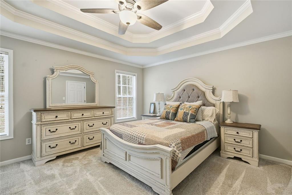 302 White Marble Way Ball Ground, GA 30107 - Photo 12 of 28 a bedroom with a bed and a dresser