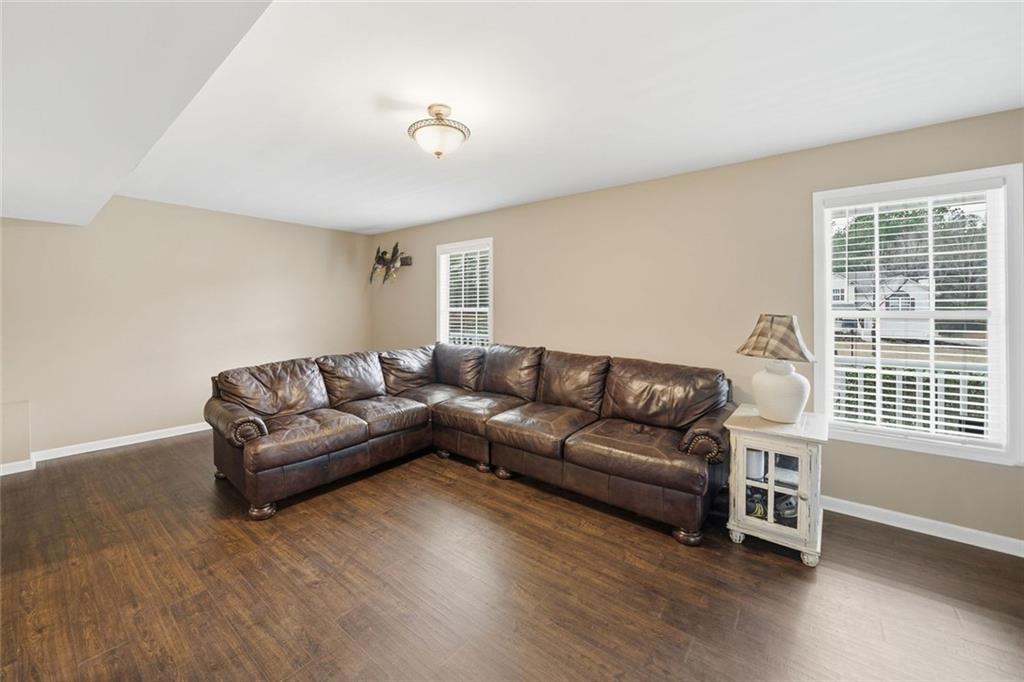 302 White Marble Way Ball Ground, GA 30107 - Photo 19 of 28 a living room with furniture and a window