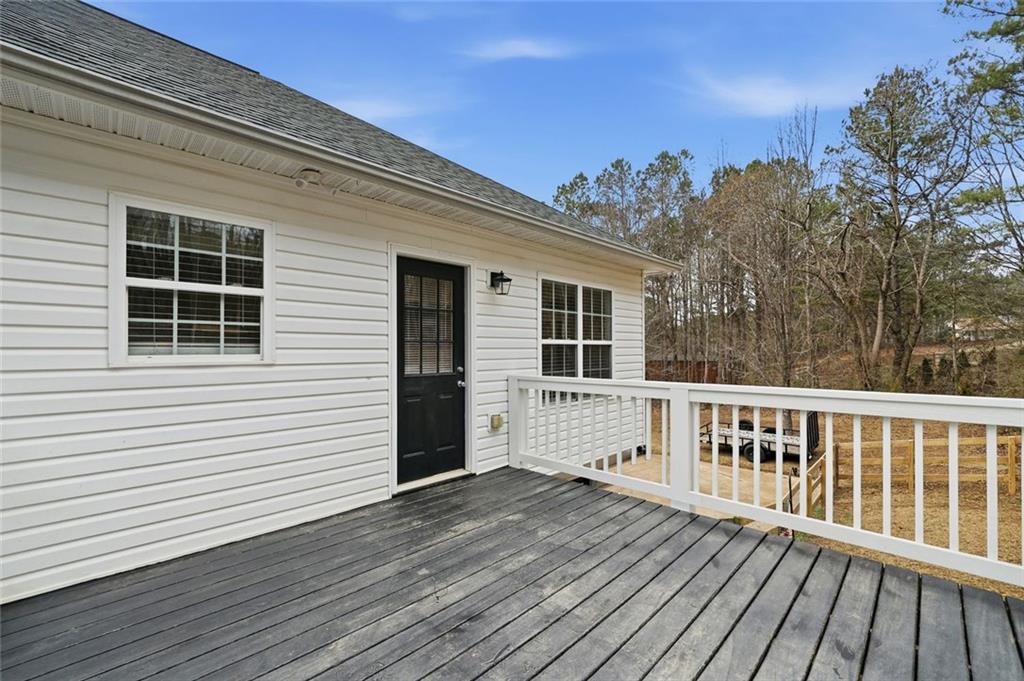 302 White Marble Way Ball Ground, GA 30107 - Photo 26 of 28 a view of a house with a deck