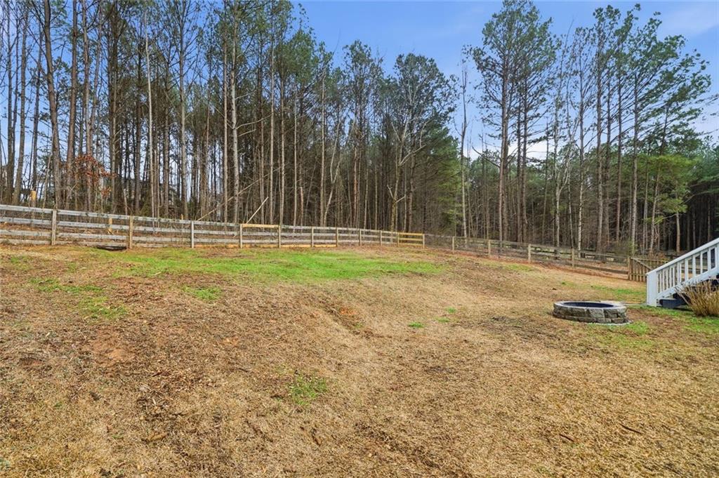 302 White Marble Way Ball Ground, GA 30107 - Photo 27 of 28 a swimming pool with trees in the background