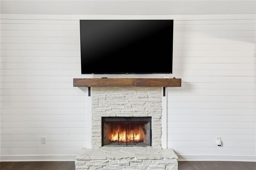 302 White Marble Way Ball Ground, GA 30107 - Photo 6 of 28 a living room with a fireplace