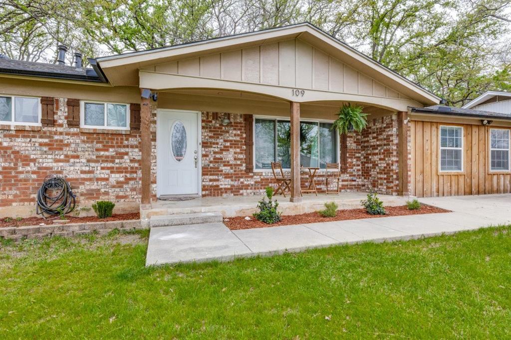 109 North Ash Avenue Azle, TX 76020 - Photo 1 of 25 front view of a house with a yard