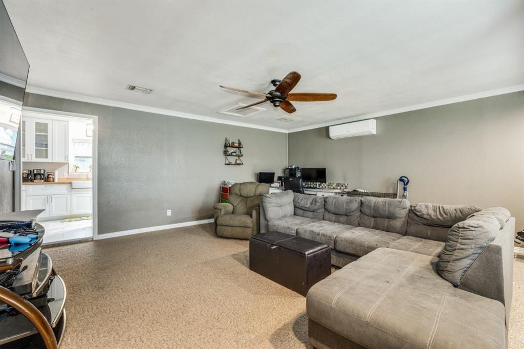 109 North Ash Avenue Azle, TX 76020 - Photo 11 of 25 a living room with furniture and a ceiling fan