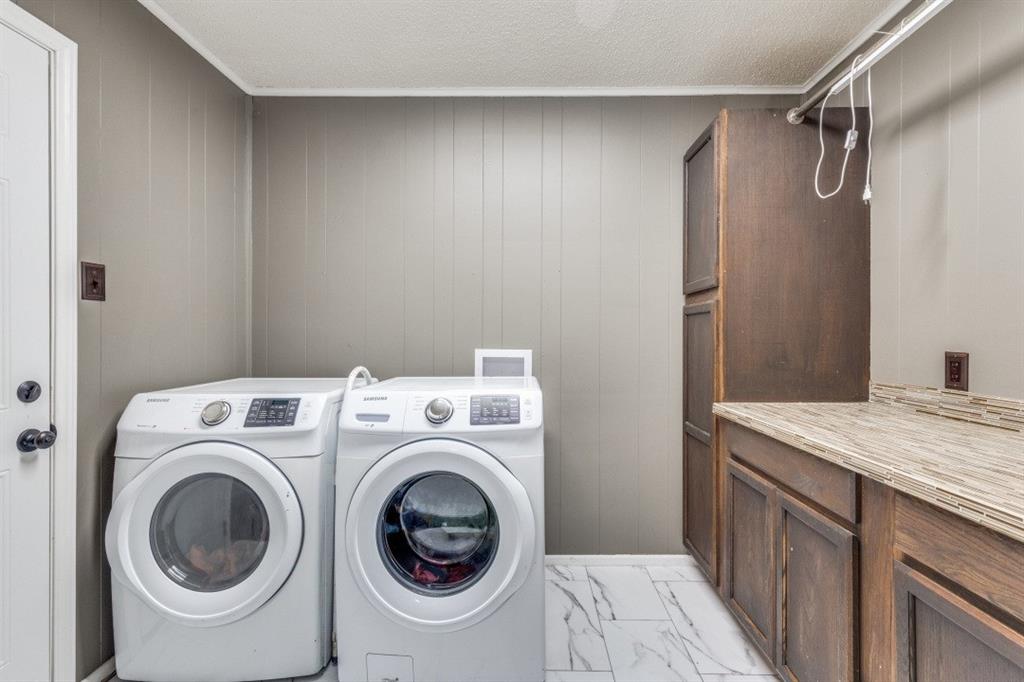 109 North Ash Avenue Azle, TX 76020 - Photo 12 of 25 a utility room with dryer and washer