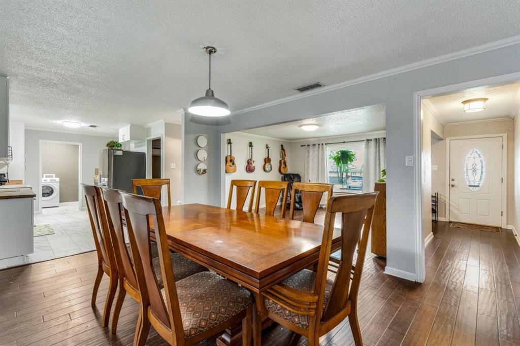 109 North Ash Avenue Azle, TX 76020 - Photo 17 of 25 a dining room with furniture and wooden floor