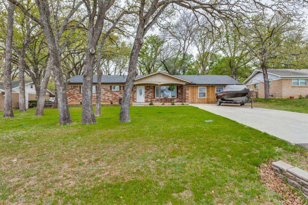 109 North Ash Avenue Azle, TX 76020 - Photo 2 of 25 front view of a house with a yard