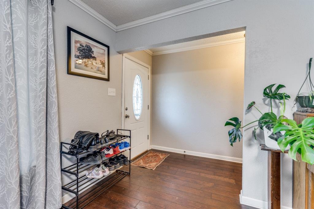 109 North Ash Avenue Azle, TX 76020 - Photo 21 of 25 a view of a workspace with furniture and a potted plant