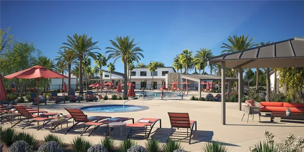 a swimming pool with outdoor seating and yard