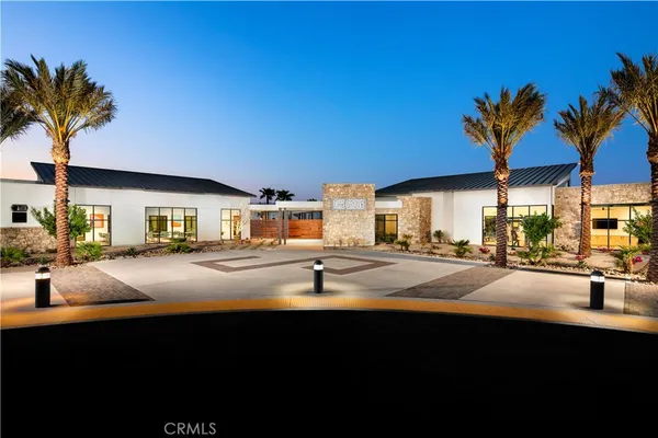 a front view of house with yard and outdoor seating