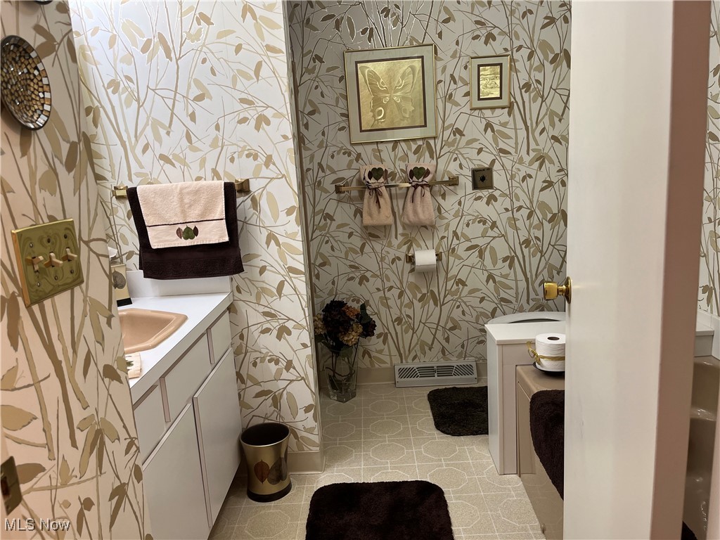 13735 Milo Road Cleveland, OH 44125 - Photo 35 of 49 Second Full Bathroom has a vanity and tile patterned flooring