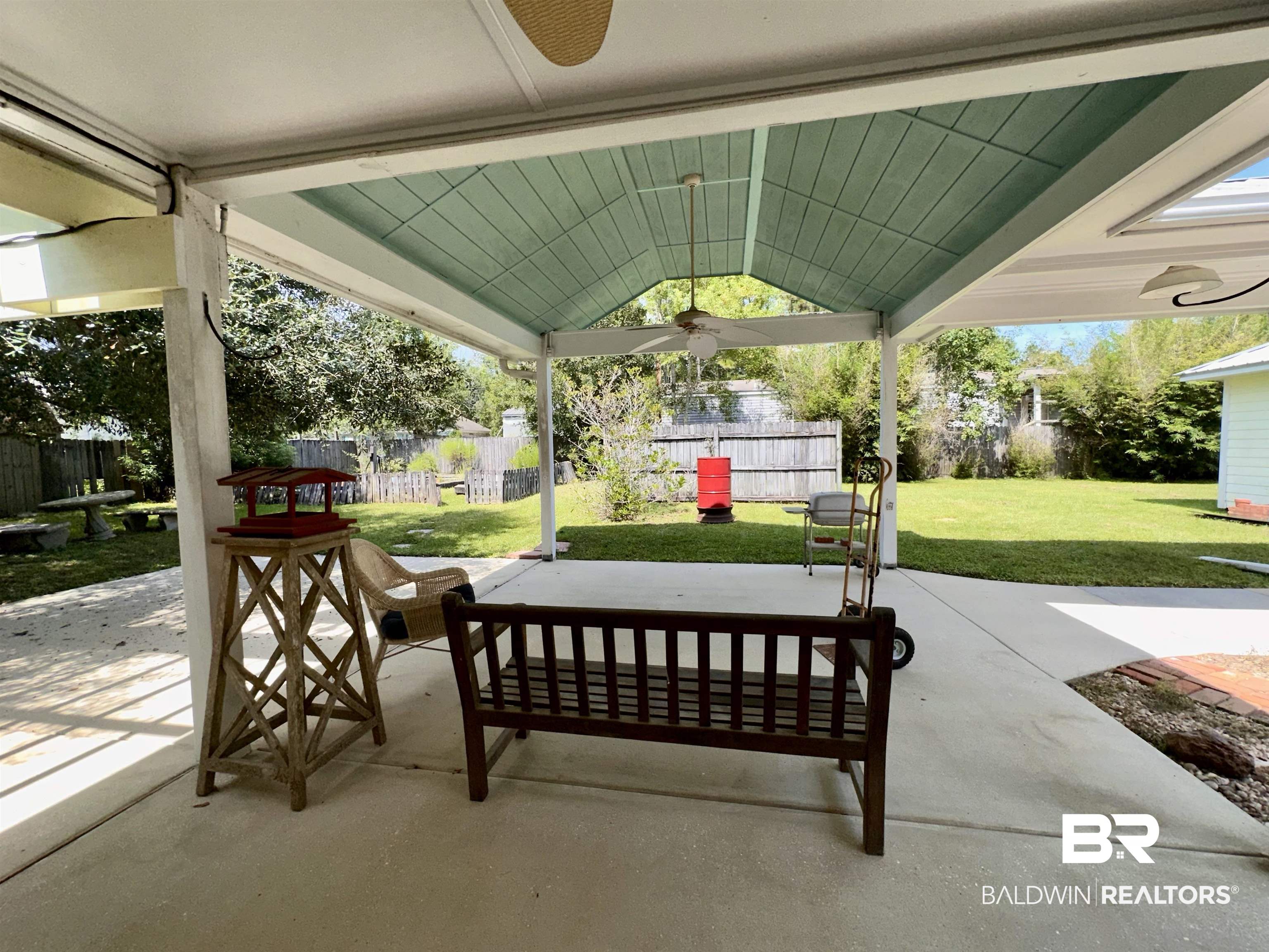 9101 Coronada Road Elberta, AL 36530 - Photo 17 of 27 Fenced backyard with a patio and ceiling fan