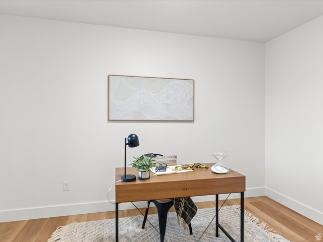 1267 West 2350 South Perry, UT 84302 - Photo 34 of 35 Bright interior room featuring light wood-finish flooring, white walls, and substantial white baseboards