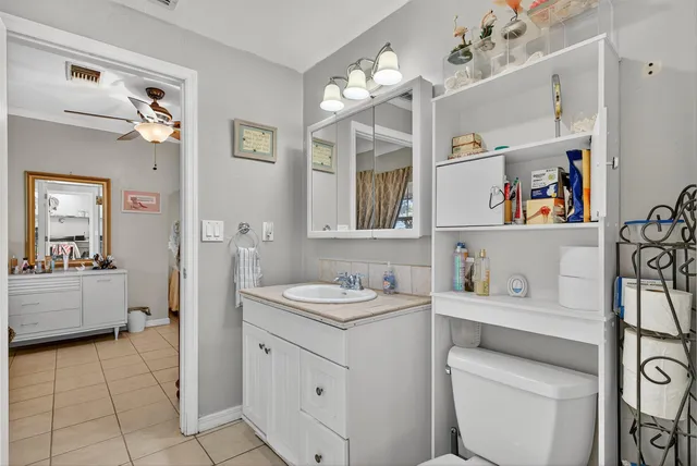 a view of a dining room with furniture and kitchen view