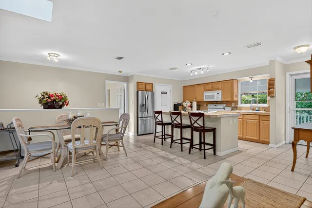 a bedroom with a bed and furniture with mirror