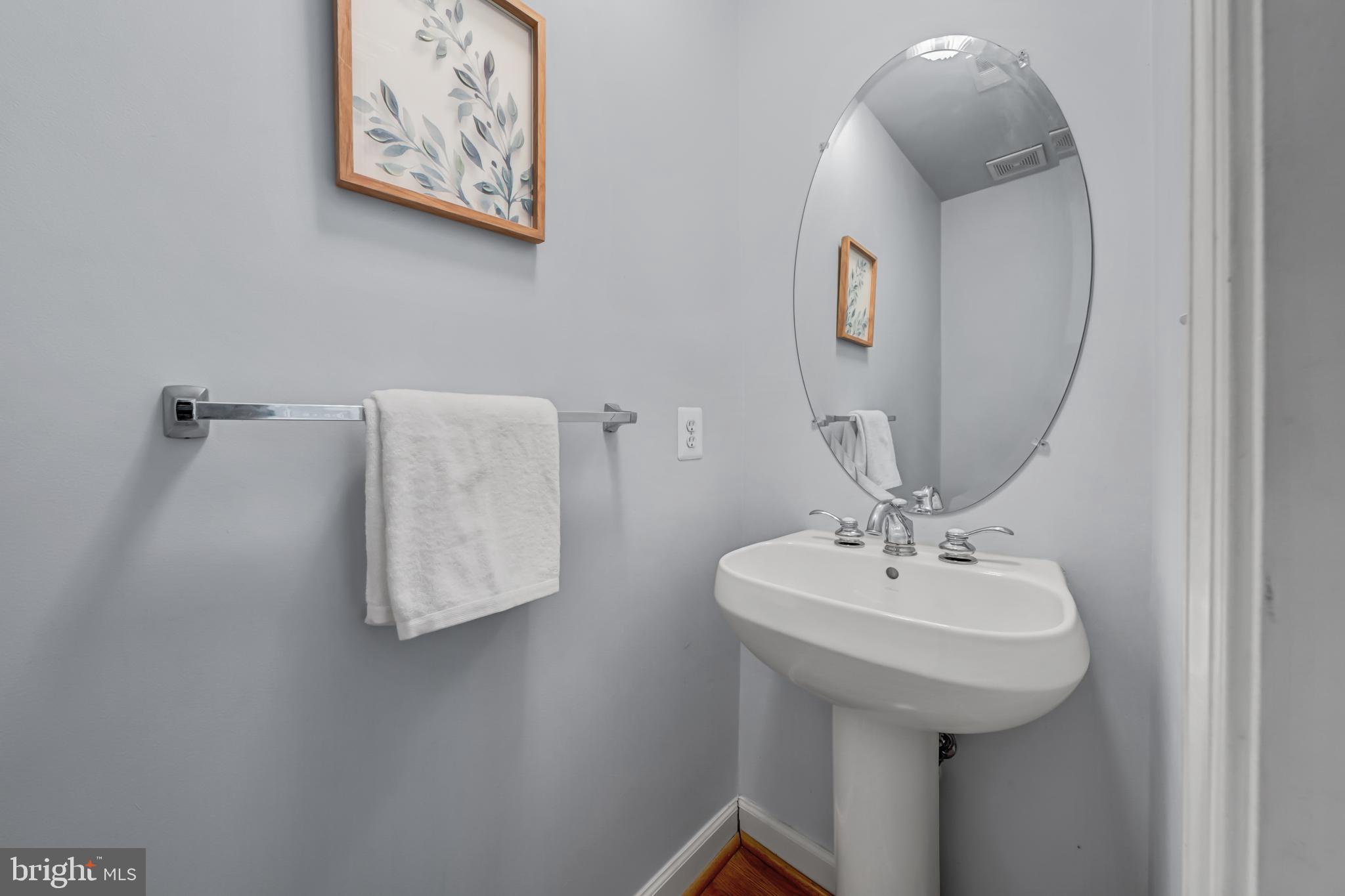 9231 Ribbon Falls Loop Bristow, VA 20136 - Photo 18 of 40 a bathroom with a sink and a mirror
