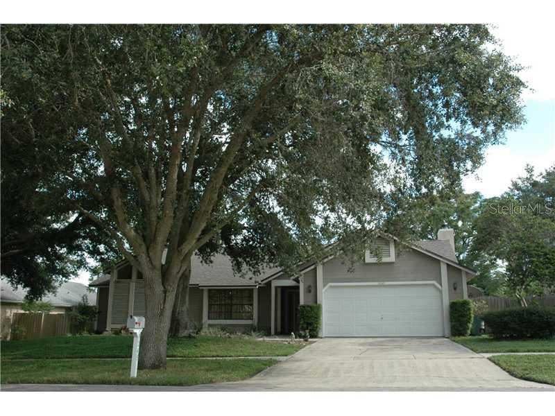 9245 Baton Rouge Drive Orlando, FL 32818 - Photo 1 of 1 a front view of a house with a garden