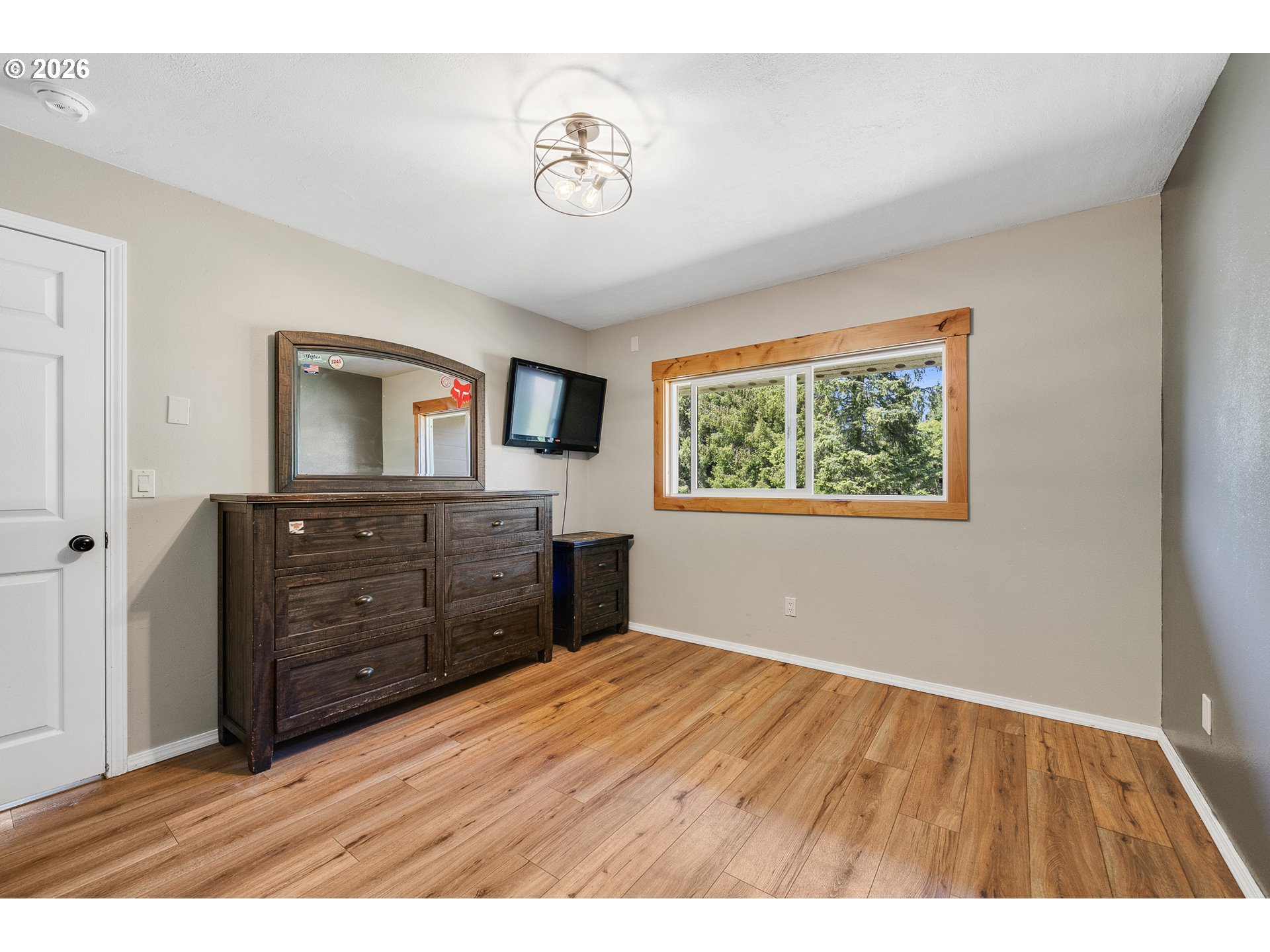 850 Hodgdon Road Tillamook, OR 97141 - Photo 13 of 43 a room with a dresser and a mirror