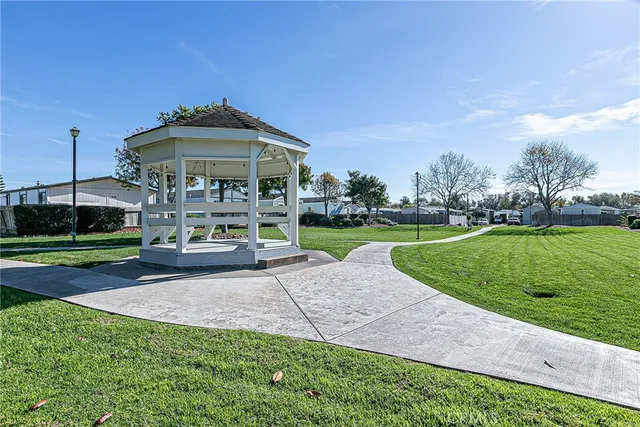 a view of a park with plants and bench
