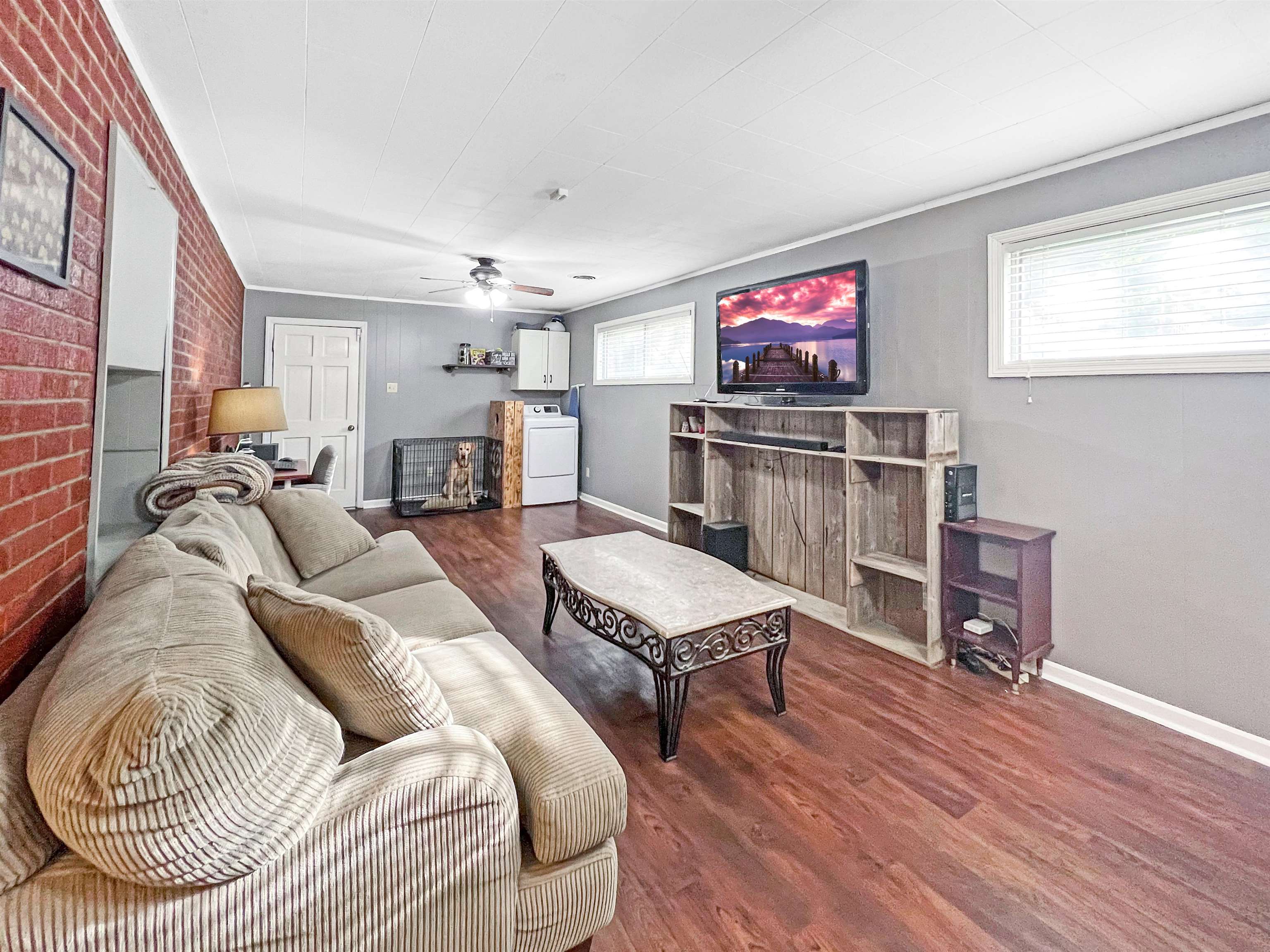 1396 Whitewater Road Memphis, TN 38117 - Photo 11 of 25 a living room with furniture and a flat screen tv