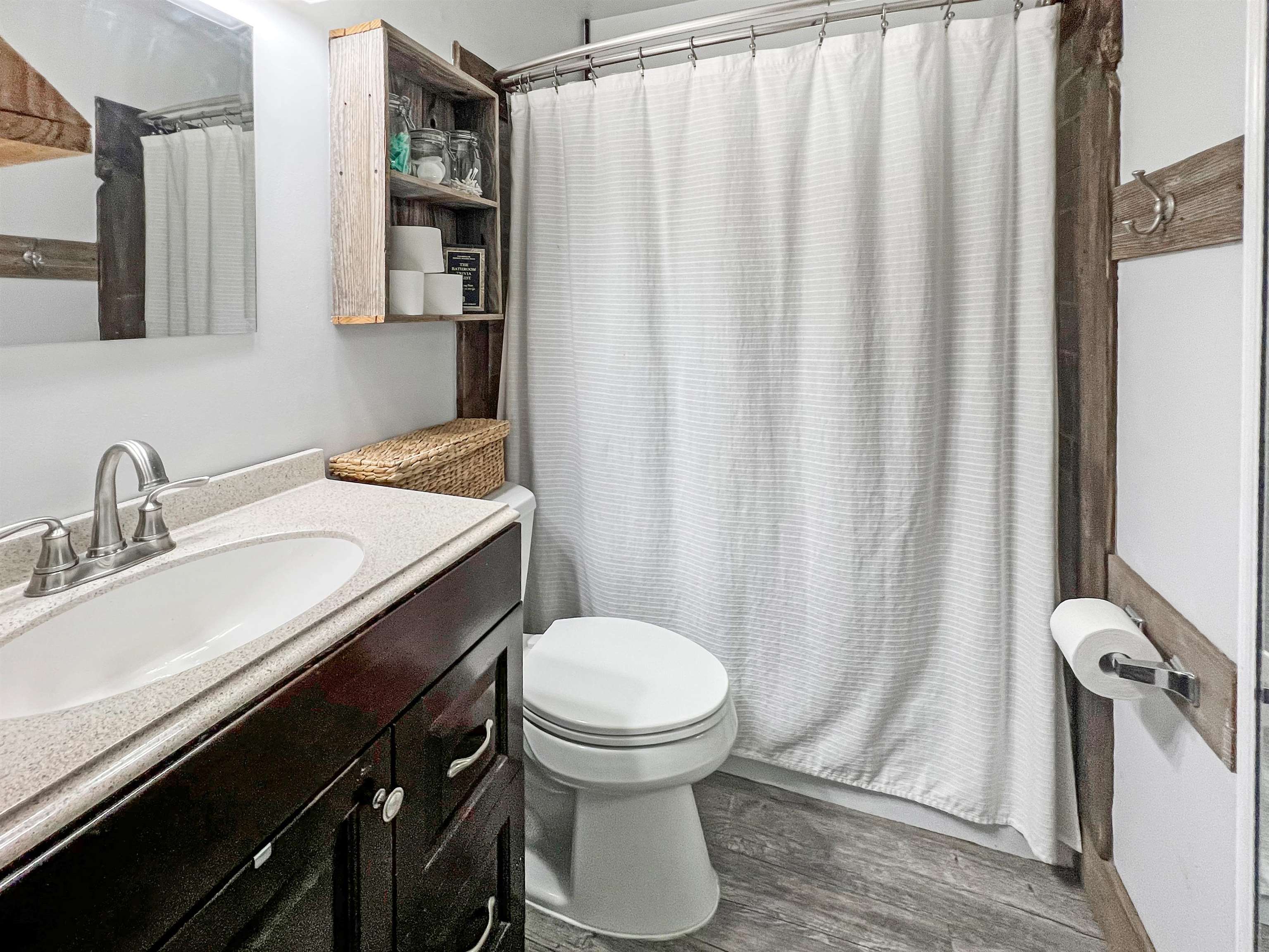 1396 Whitewater Road Memphis, TN 38117 - Photo 20 of 25 a bathroom with a sink a toilet and a mirror