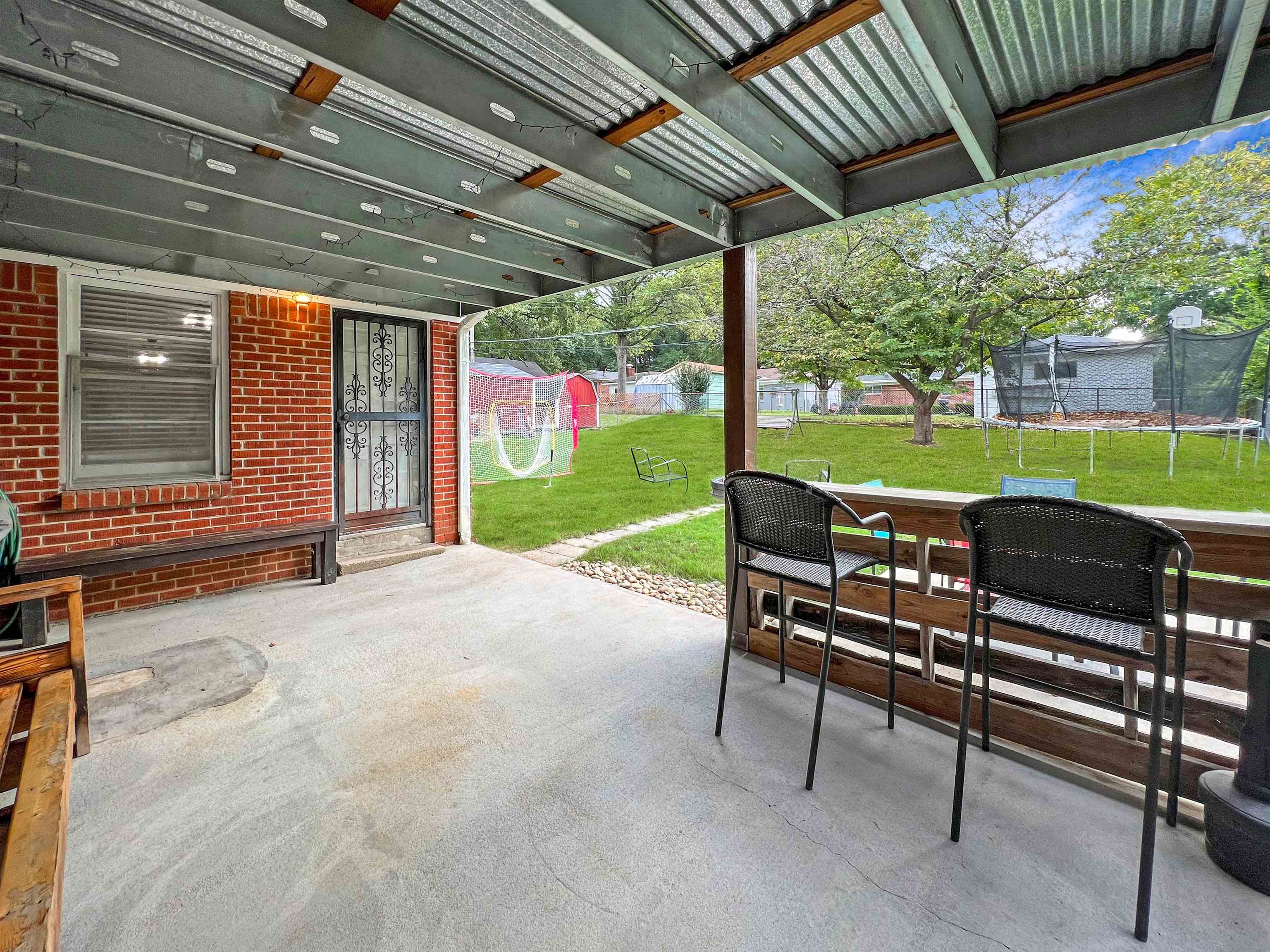 1396 Whitewater Road Memphis, TN 38117 - Photo 23 of 25 a view of a porch with furniture and garden