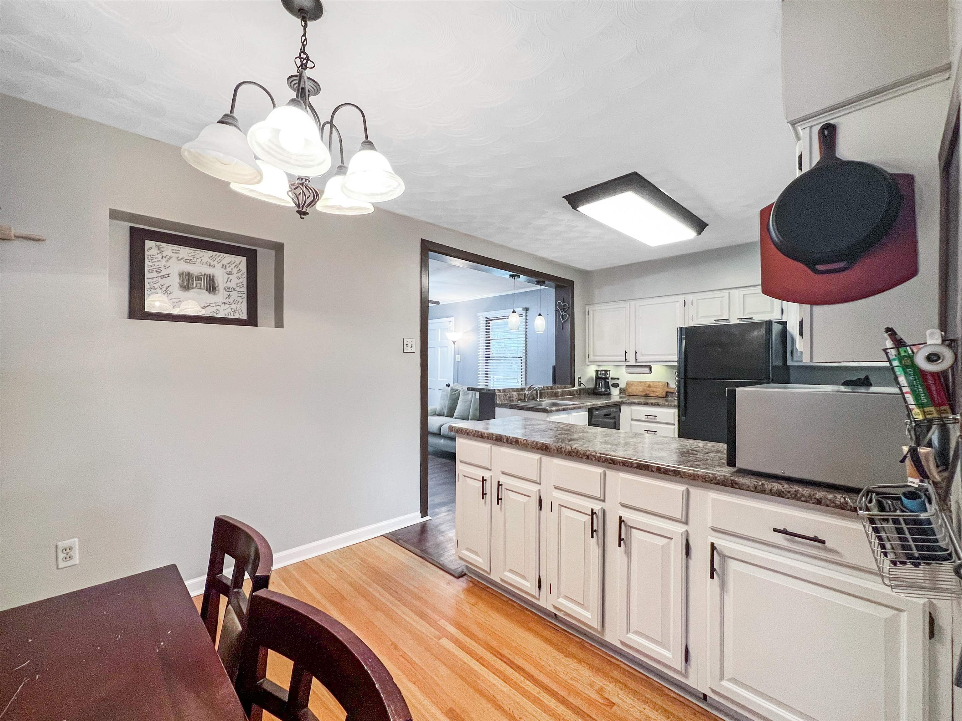 1396 Whitewater Road Memphis, TN 38117 - Photo 5 of 25 a kitchen with a sink cabinets and window