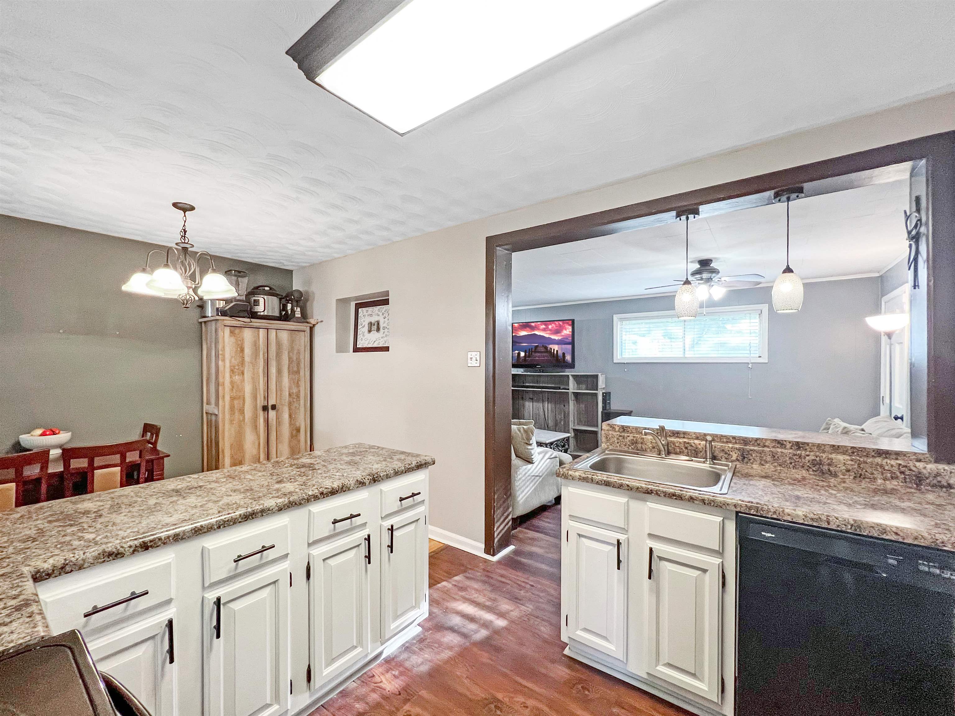1396 Whitewater Road Memphis, TN 38117 - Photo 10 of 25 a bathroom with a granite countertop sink a large mirror and a shower