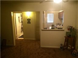 7323 Lindencrest Street, Unit 9 Houston, TX 77061 - Photo 3 of 6 a view of a hallway with workspace