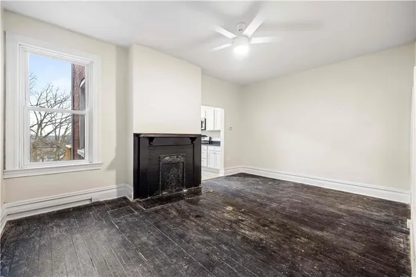 a view of an empty room with a window