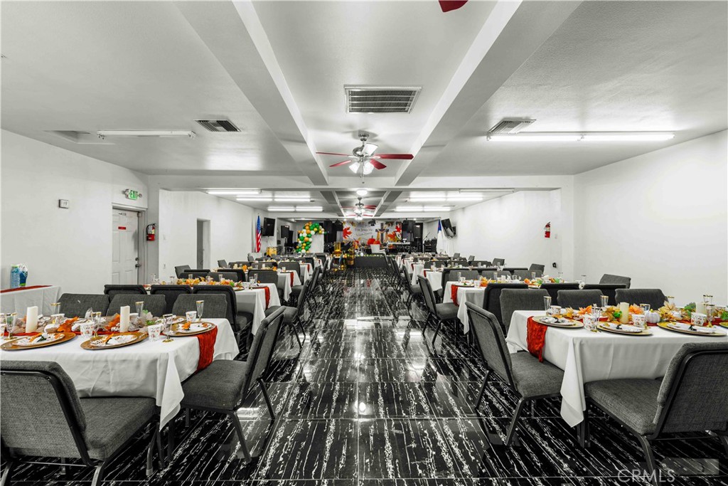 17606 Arrow Fontana, CA 92335 - Photo 16 of 30 a outdoor space with lots of tables a chandelier and couches