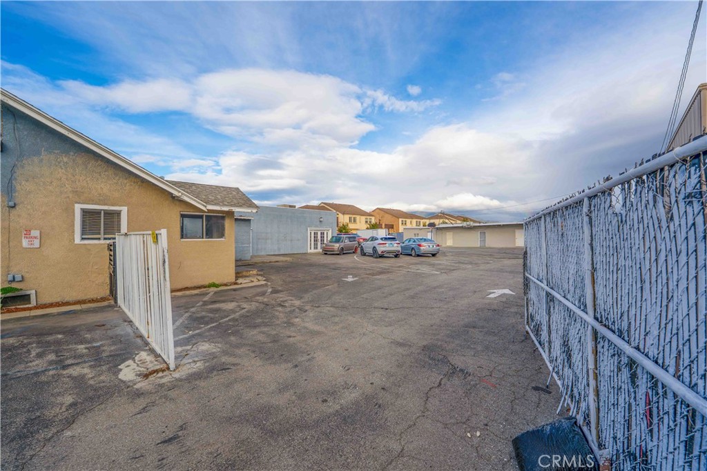17606 Arrow Fontana, CA 92335 - Photo 4 of 30 a view of a house with wooden fence