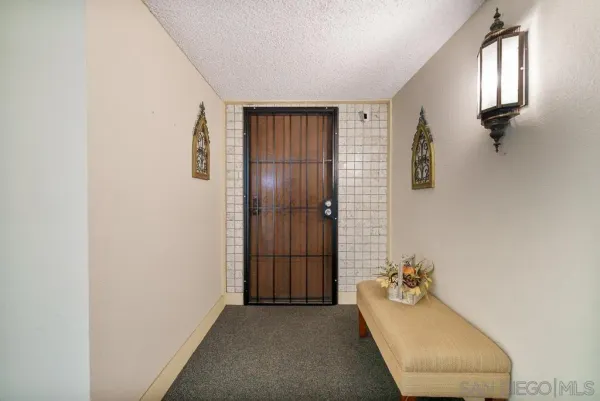 a view of a bedroom with washer and dryer