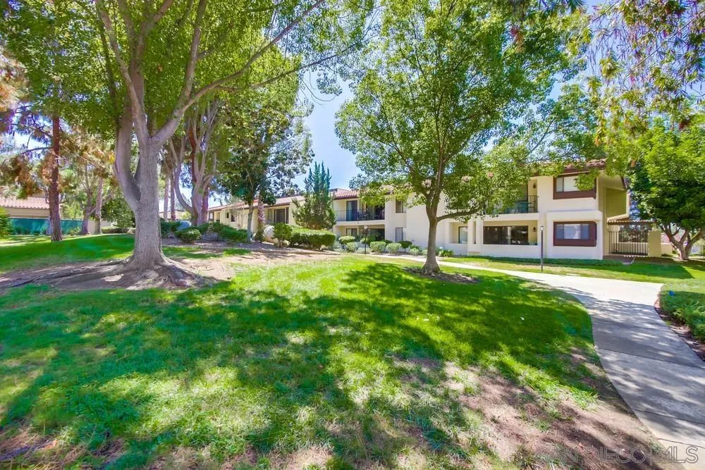 17637 Pomerado Road, Unit 123 San Diego, CA 92128 - Photo 38 of 52 a view of a house with a yard and tree s