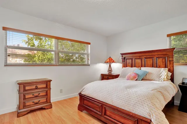 a bathroom with a shower sink and mirror