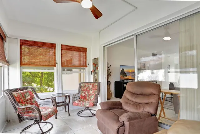 a bedroom with a bed dresser and wooden floor