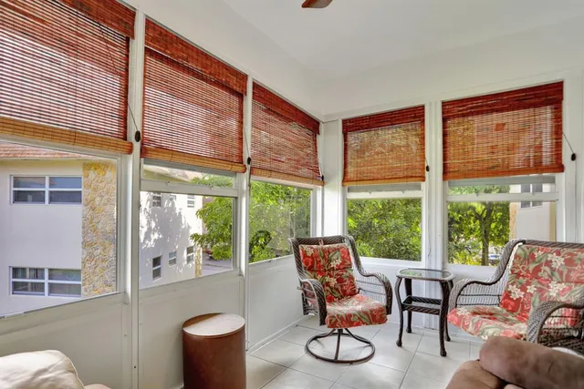 a bathroom with a sink vanity and shower