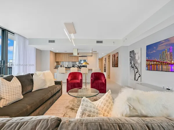 a bed room with furniture and window