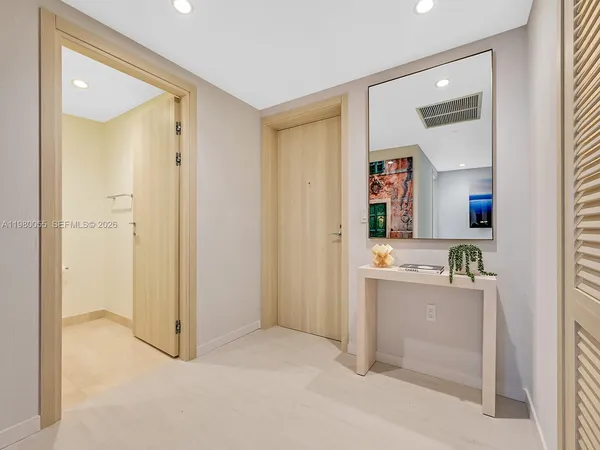 a bathroom with a shower sink vanity and mirror