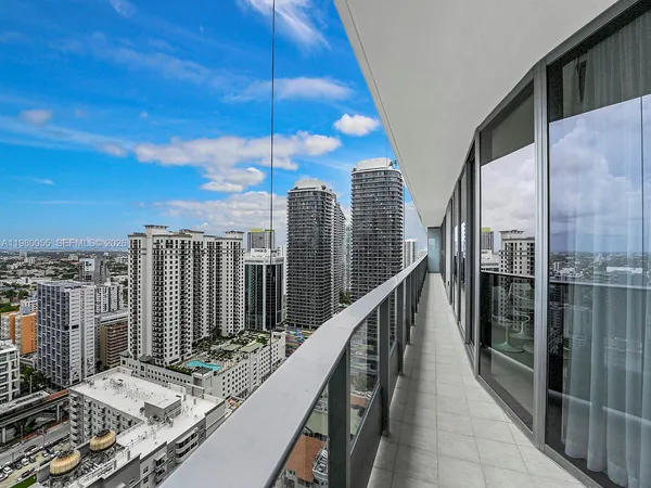 a view of roof deck with wooden floor and outdoor seating
