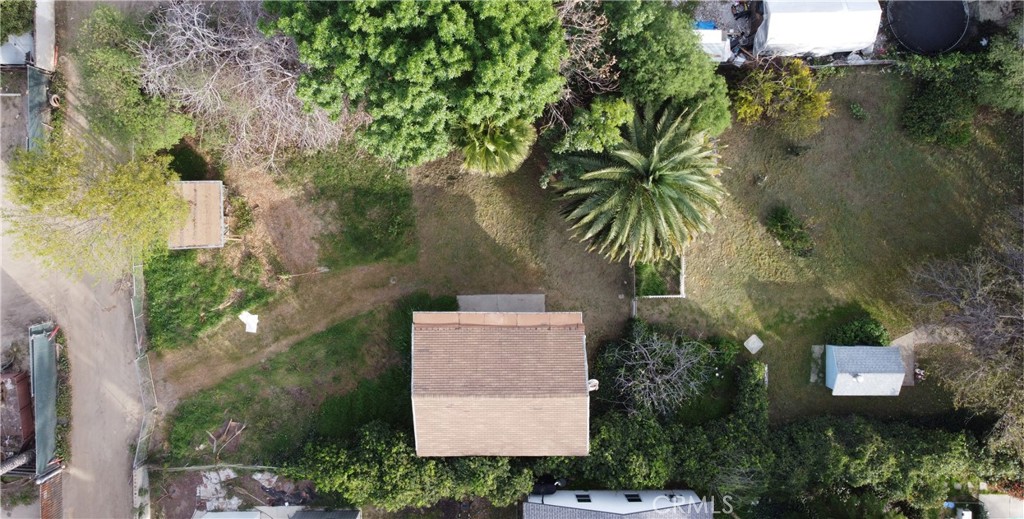 19131 Lanark Street Reseda, CA 91335 - Photo 13 of 14 an aerial view of a house with swimming pool and garden