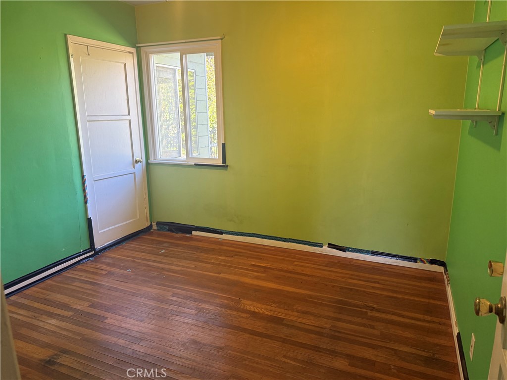 19131 Lanark Street Reseda, CA 91335 - Photo 4 of 14 a view of empty room with window and hardwood