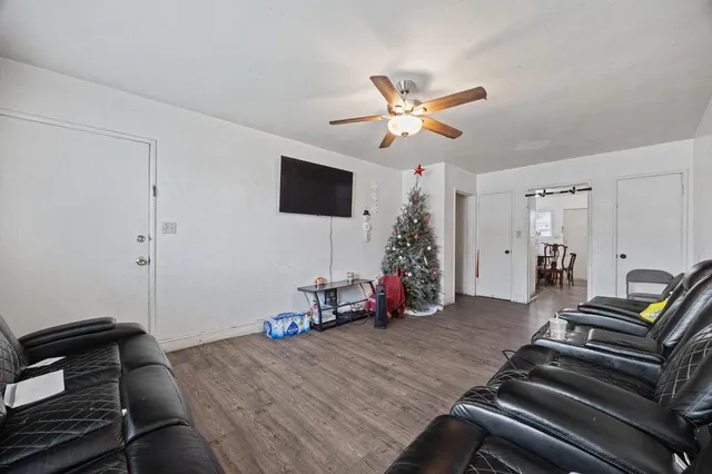 a view of a room with wooden floor and gym equipment