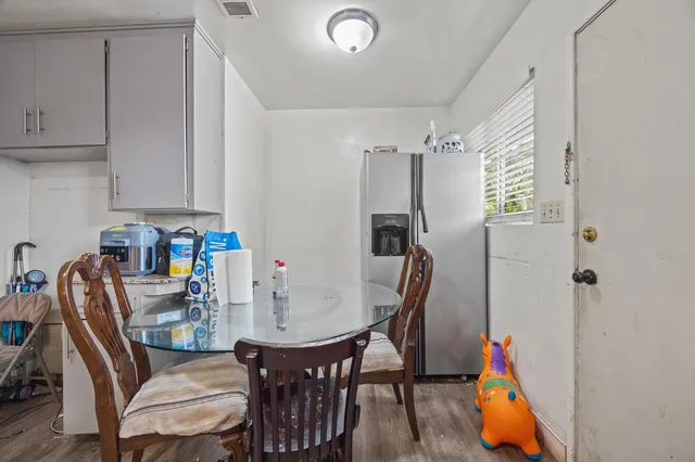 a dining room with furniture and window