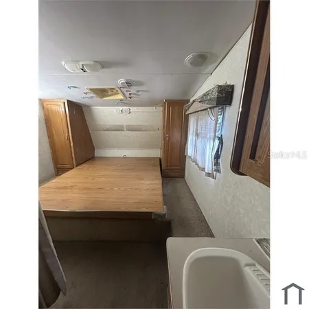 a en suite bathroom with a toilet sink and mirror