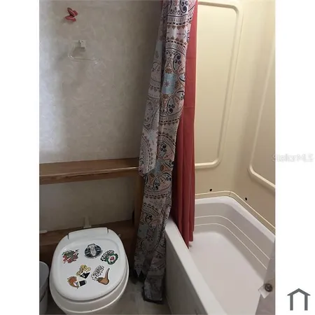 a bathroom with a toilet and a sink