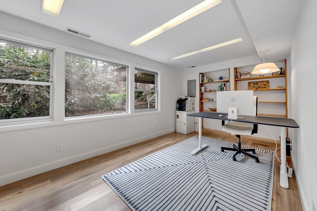 85 The Valley Road Concord, MA 01742 - Photo 30 of 38 a workspace with wooden floor and a window